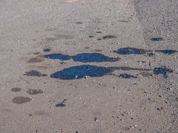 Oil stains on asphalt parking lot